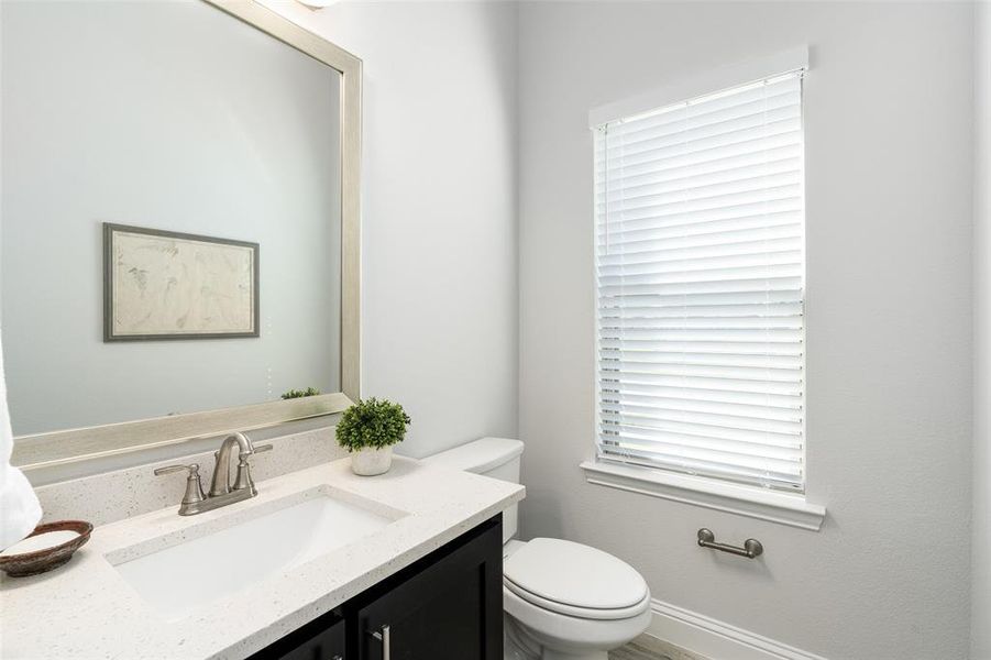 Bathroom featuring vanity and toilet