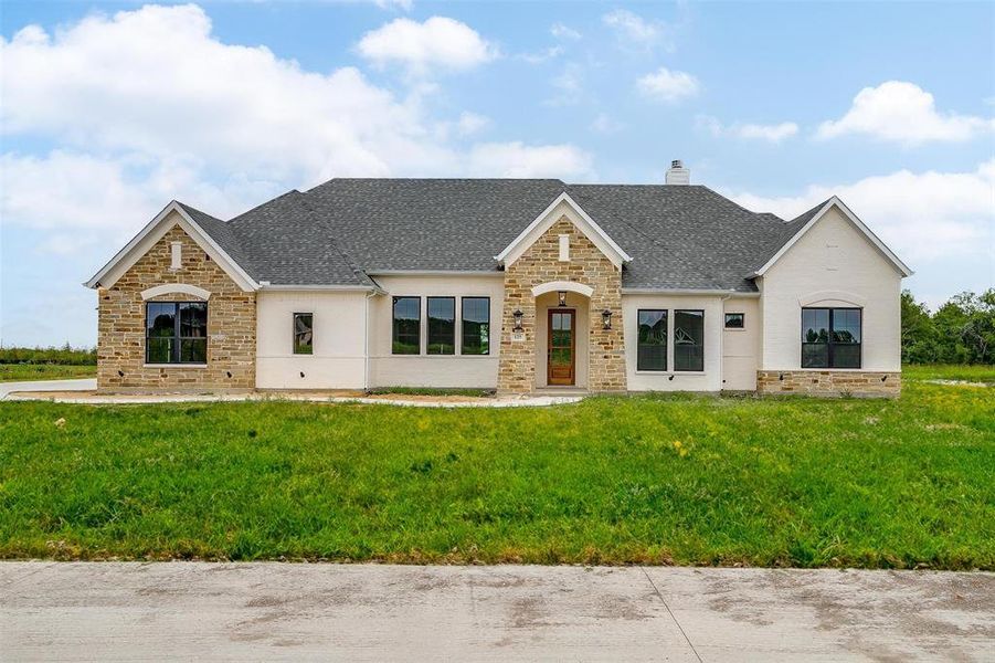 View of front of property with a front lawn