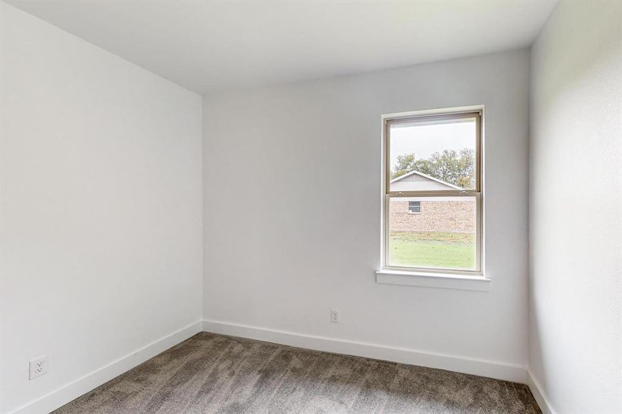 Unfurnished room featuring carpet flooring