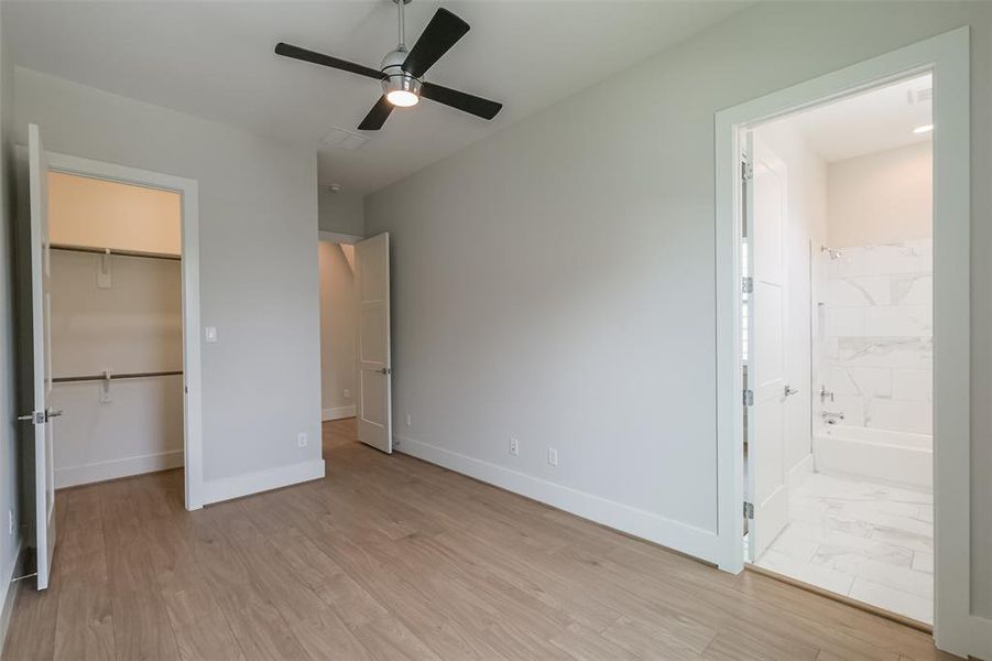 Secondary bedroom with large closet and en-suite bath.