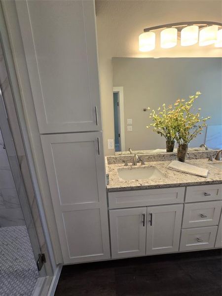 Bathroom featuring vanity and hardwood / wood-style floors