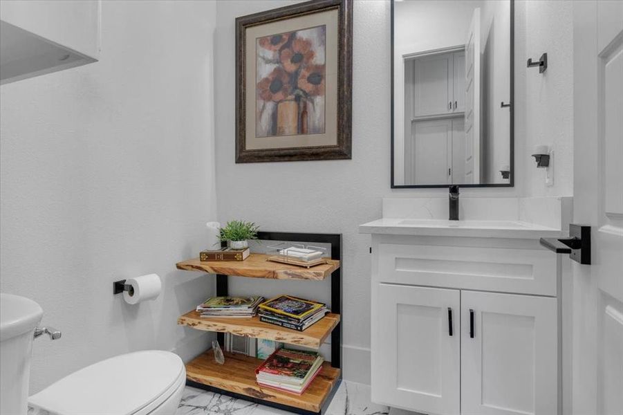 Bathroom featuring vanity and toilet