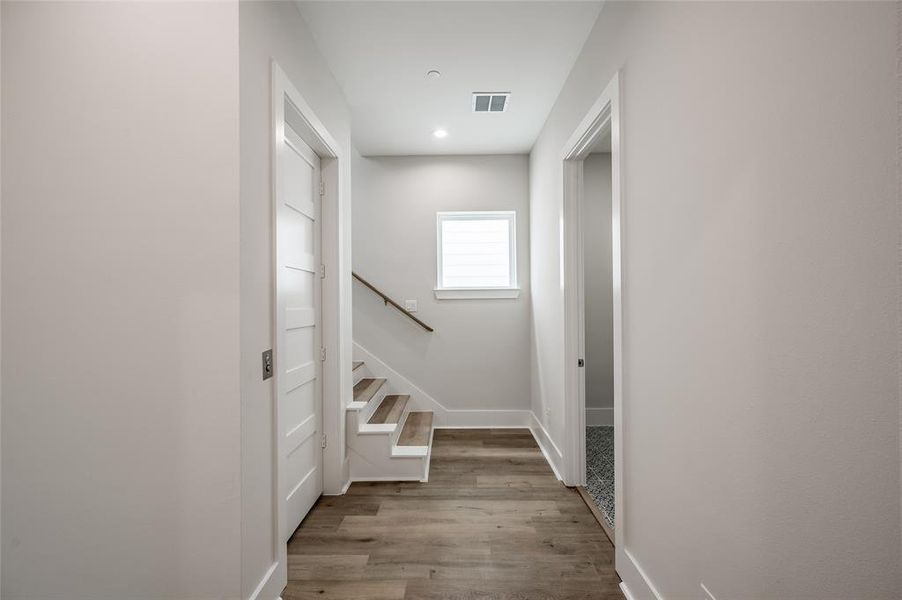 The elevator on the left opens onto the third floor landing granting easy access to the laundry room, primary and secondary bedrooms.