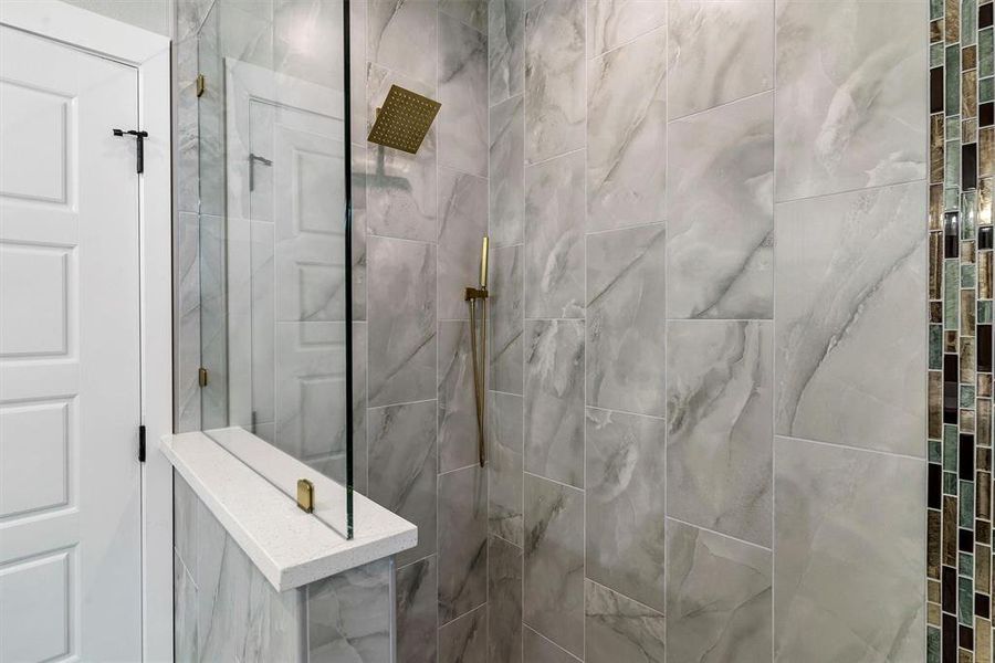 Bathroom with tiled shower