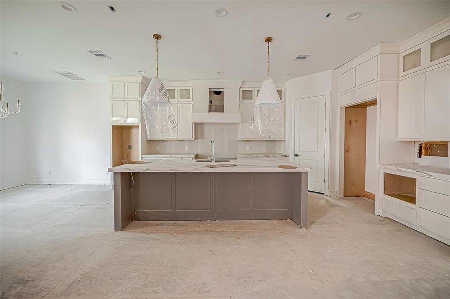 Kitchen with custom cabinetry (Construction Photo 10/11/24)