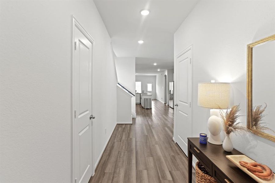 Welcome to a warm and inviting entryway, complete with convenient storage and utility space immediately to your left.