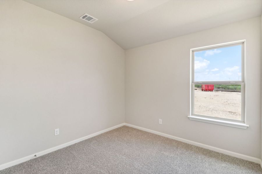 Guest bedroom in the Callaghan floorplan at a Meritage Homes community.