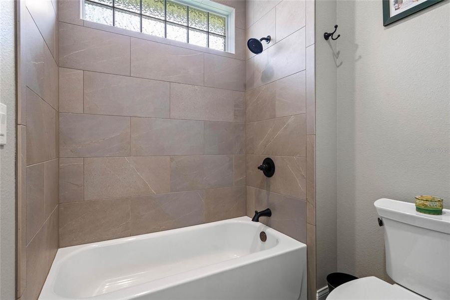 Jack & Jill bath features a Water Closet with Tub/Shower