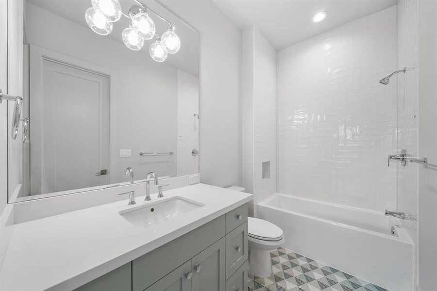 The beautiful bathroom serves the final bedroom and the game room!