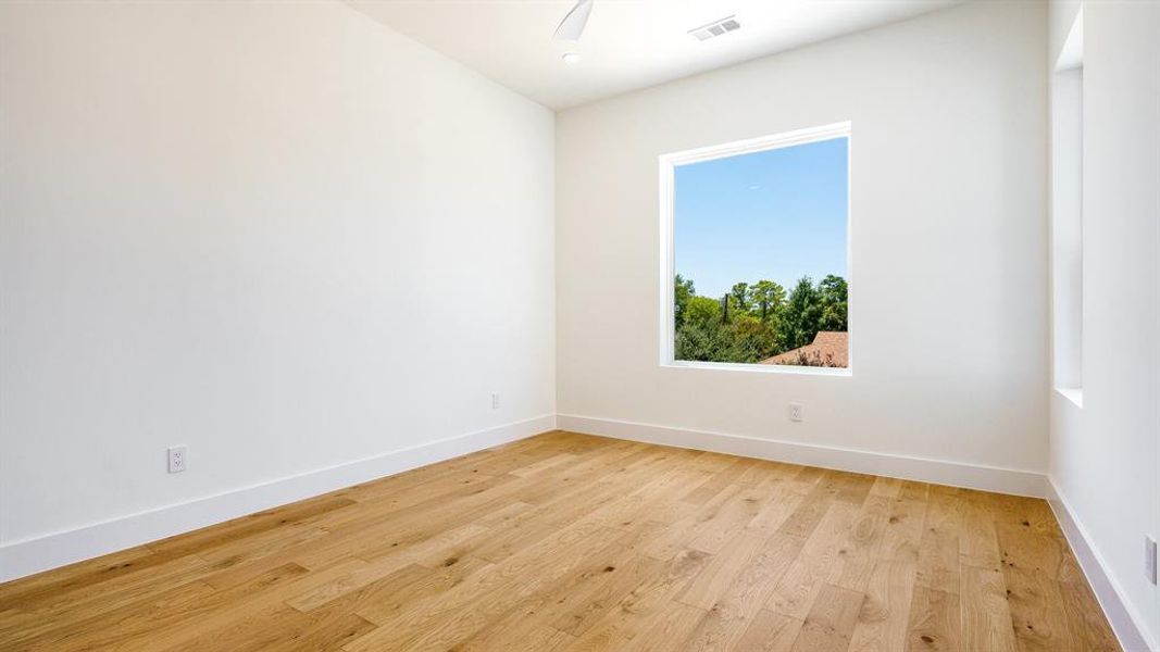 Spare room featuring light hardwood / wood-style flooring and ceiling fan