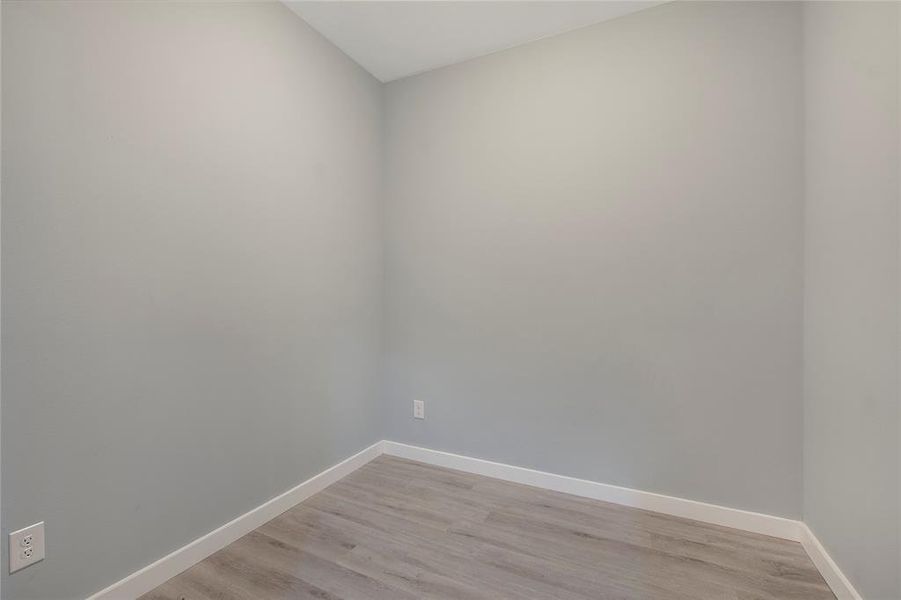 Empty room featuring light wood-type flooring