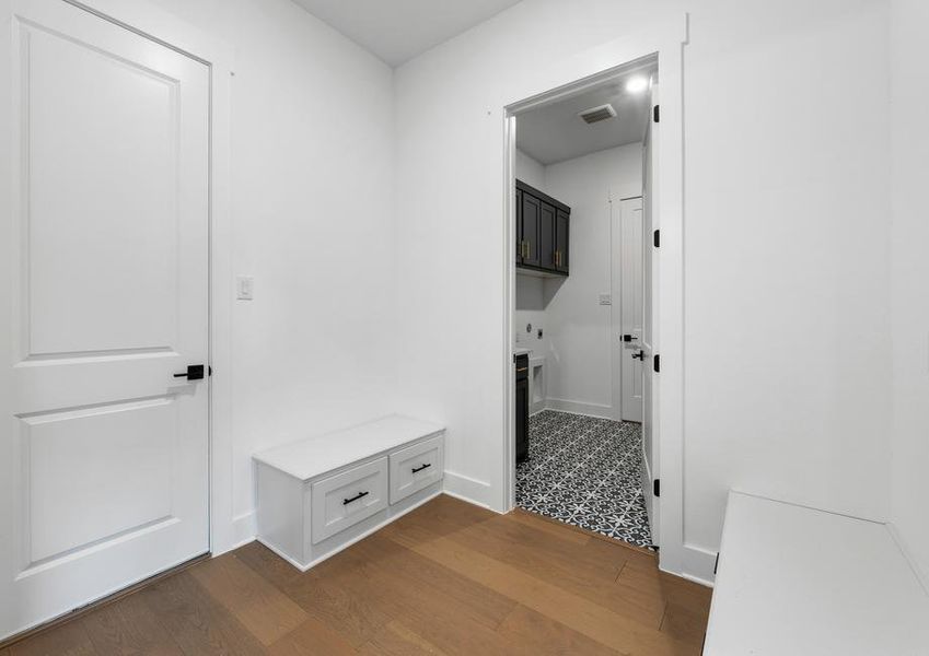 The mudroom is the perfect space to store your family's things right by the door to the garage, and it is adjacent to the large laundry room.