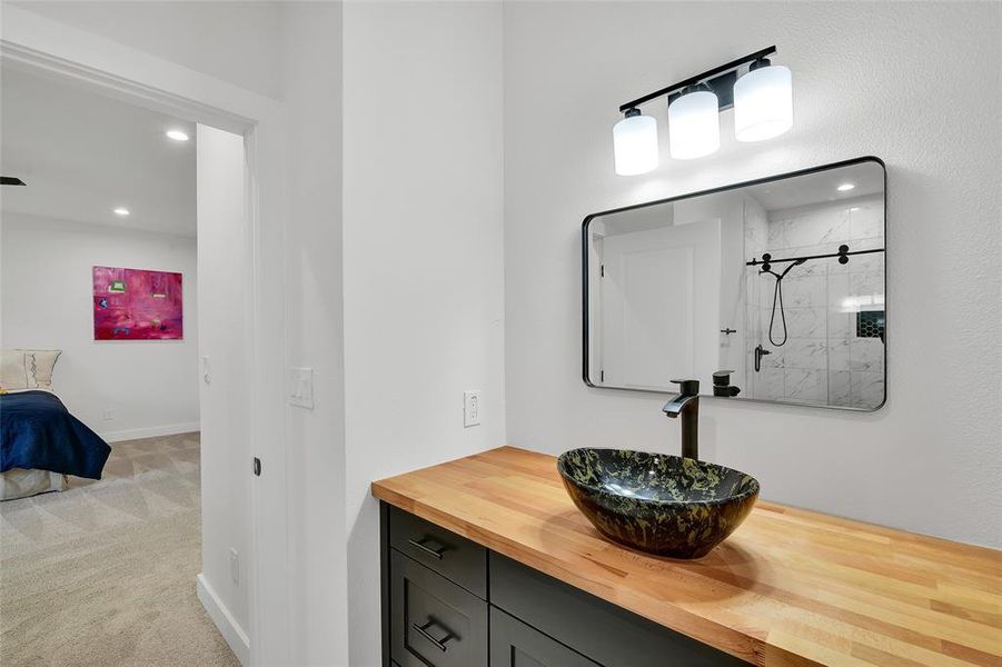 Primary Bathroom with vanity and tiled shower