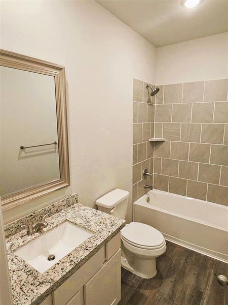 Bath 2 includes granite counters, framed mirror & ceramic tile tub/shower walls