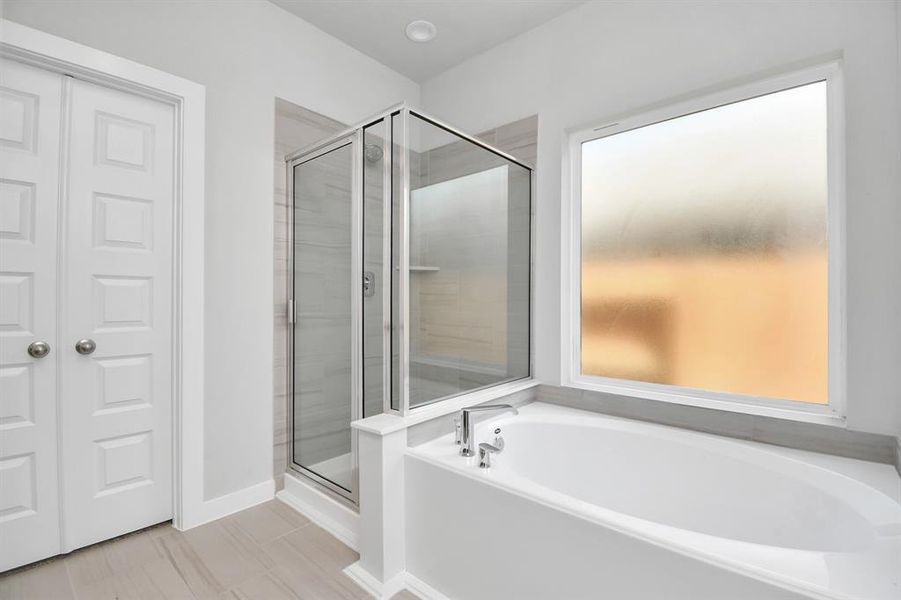 Another view of the primary bath. Photo shown is example of completed home with similar plan.