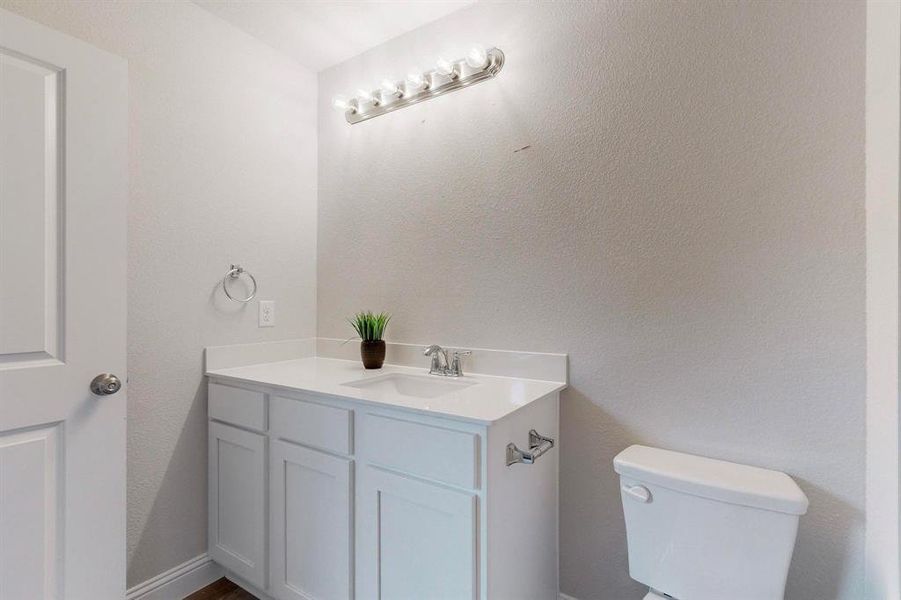 Bathroom with vanity and toilet