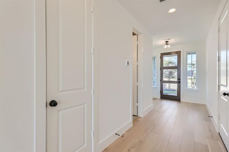 Doorway to outside featuring light wood-type flooring