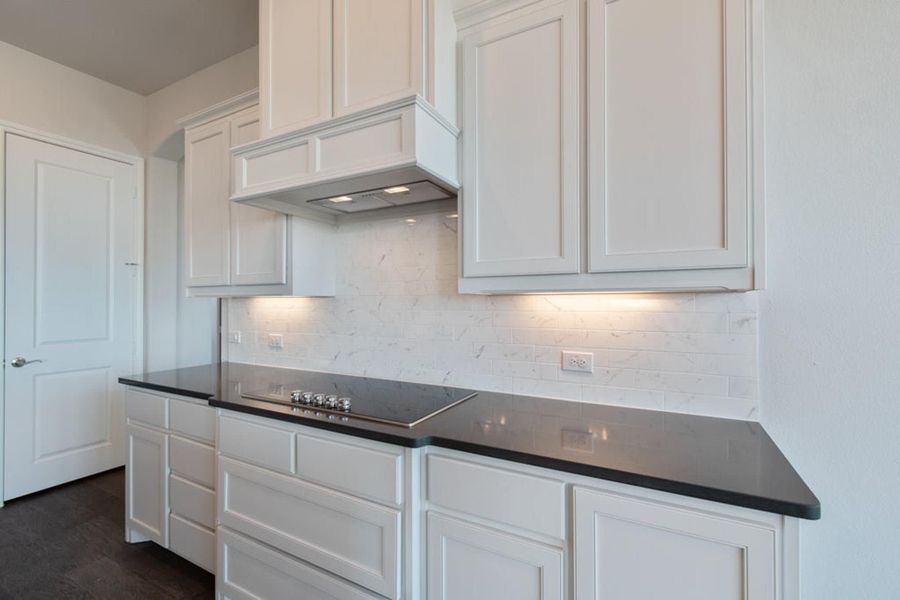 Kitchen | Concept 2406 at Hidden Creek Estates in Van Alstyne, TX by Landsea Homes