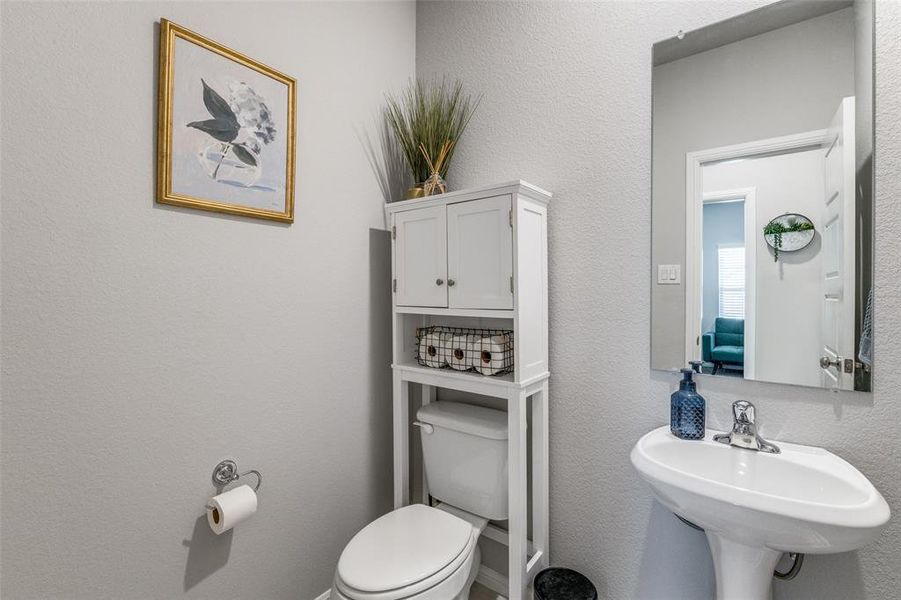 Bathroom with sink and toilet