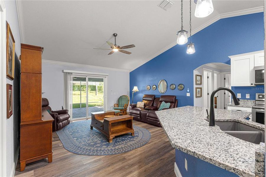 Kitchen is open to the family room that has vaulted ceiling