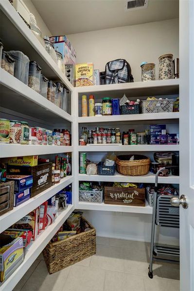 Walking pantry with lots of spaces for storage.