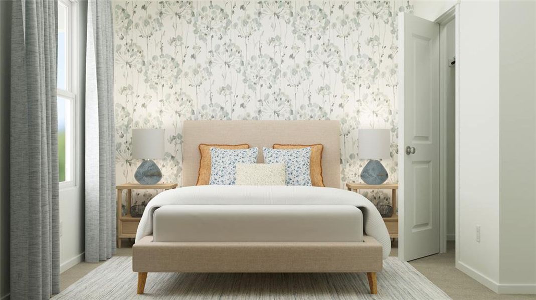 Bedroom featuring light colored carpet