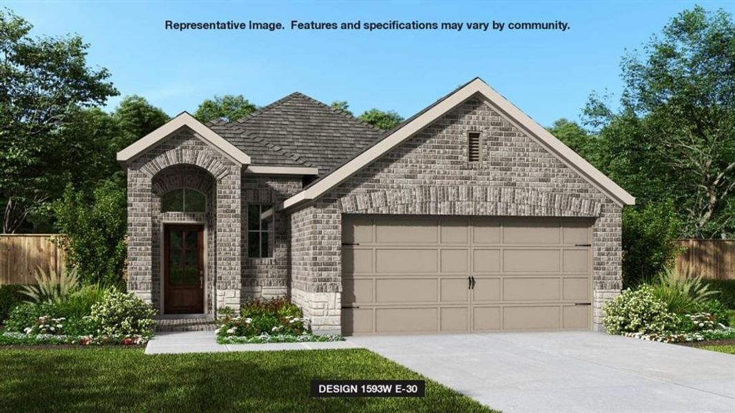 View of front facade featuring a garage