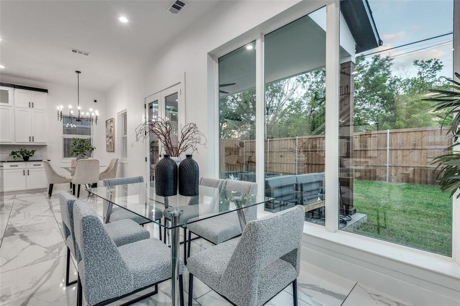 Dining area overlooking the private backyard.