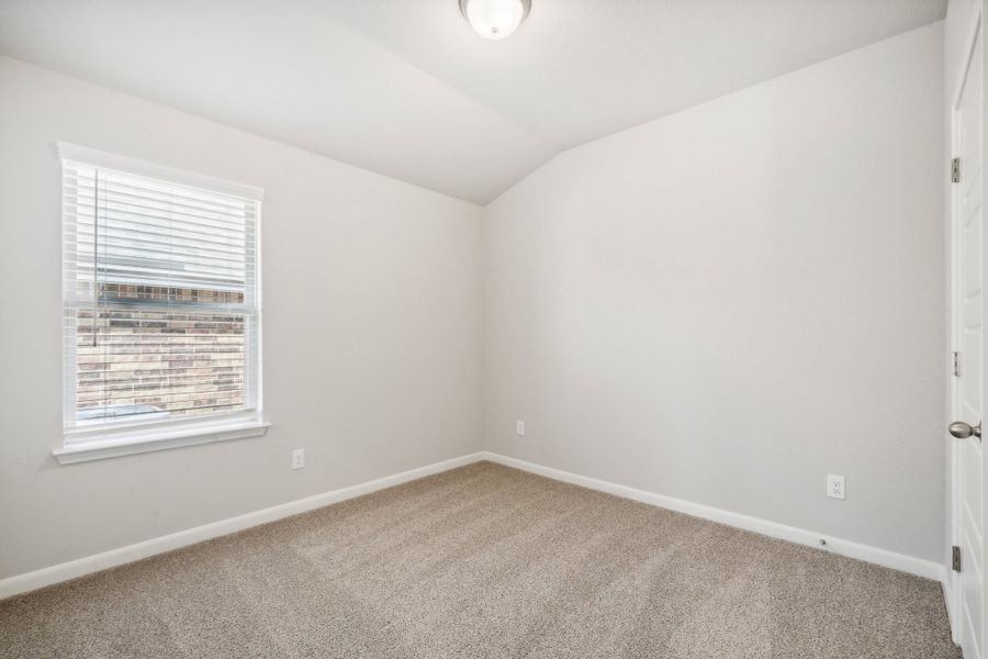 Guest bedroom in the Fitzhugh floorplan in a Meritage Homes community.