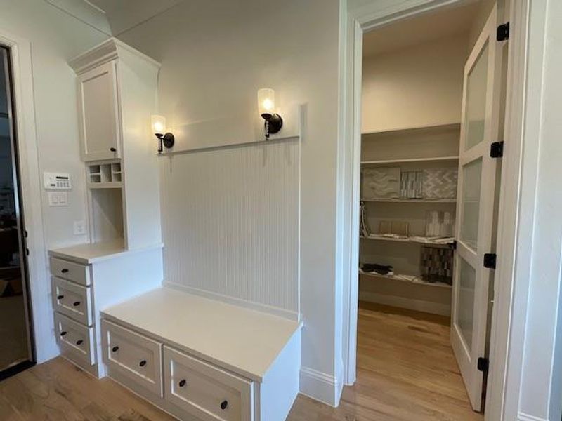 Mudroom with light wood-type flooring