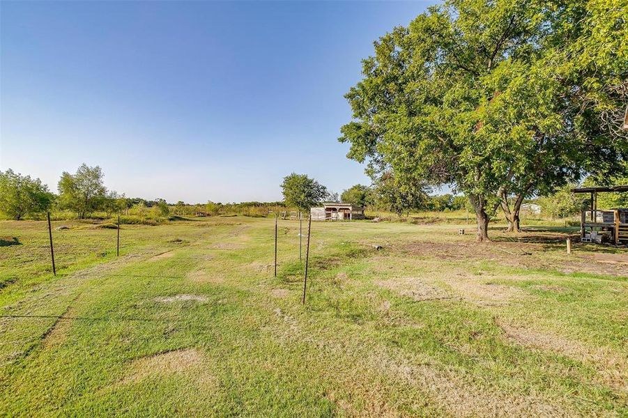 View of yard with a rural view