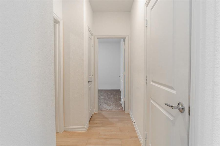 Hall featuring light wood-type flooring