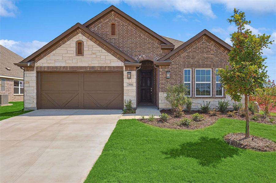 View of front of home with a front yard and central AC