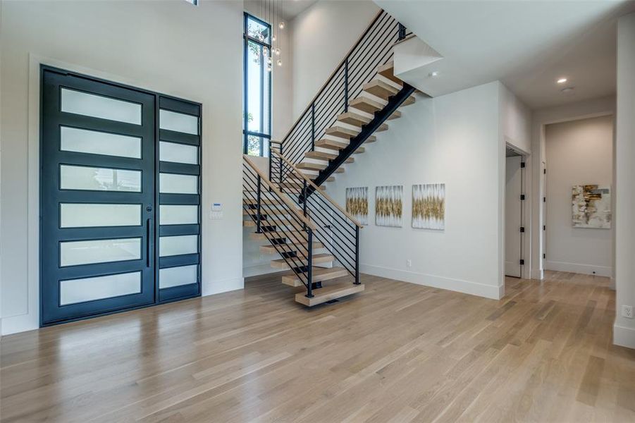 Entryway with light hardwood / wood-style floors