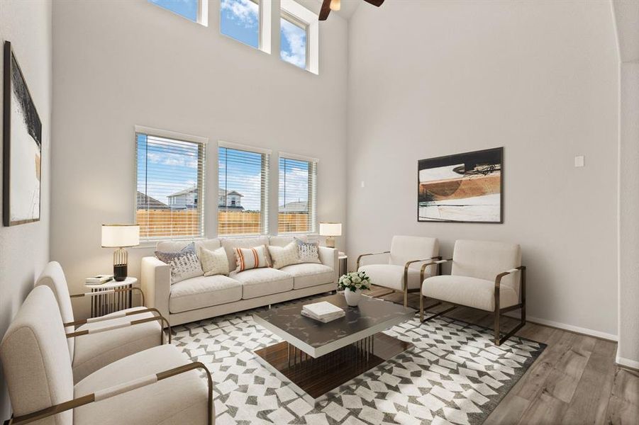 Your family room has ample space to entertain family and friends. This space features beautiful floors, fresh paint, ceiling fan with lighting, and high ceilings.