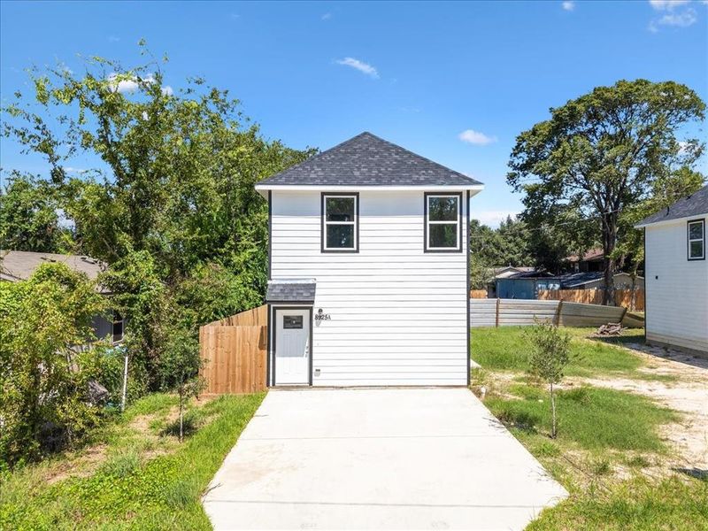 The level driveway and entry provide a smooth and convenient arrival to your new home.