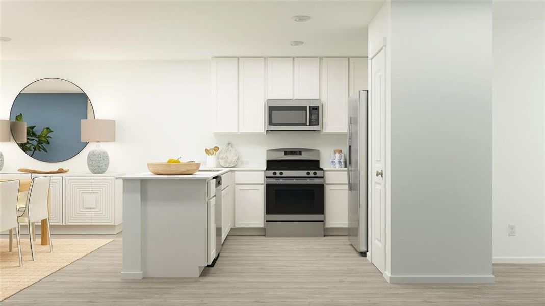 Kitchen with stainless steel appliances, white cabinets, and light wood-type flooring