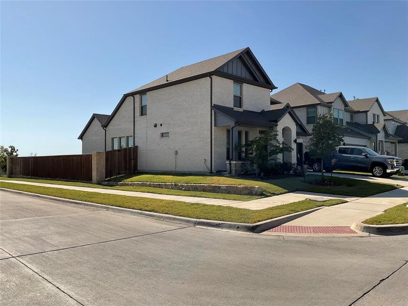 View of side of home with a lawn