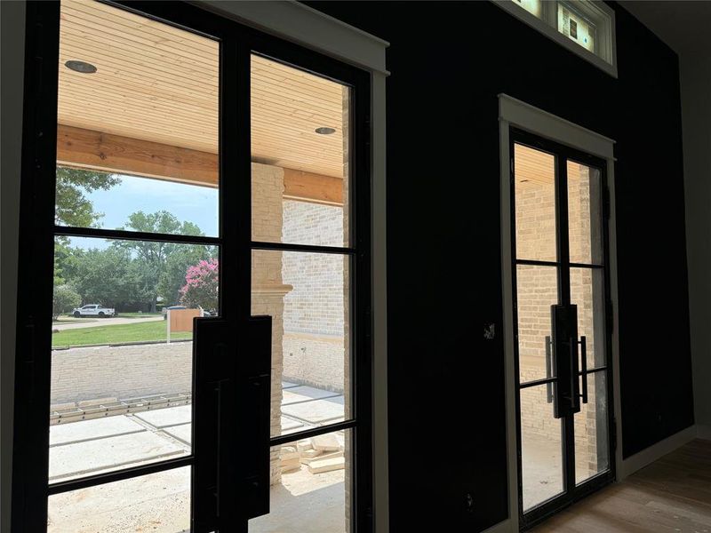 Double Metal French Doors in MIL Suite that lead out to courtyard.