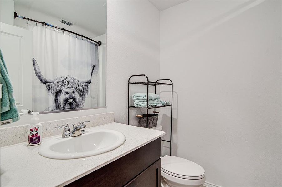 Bathroom with toilet and vanity