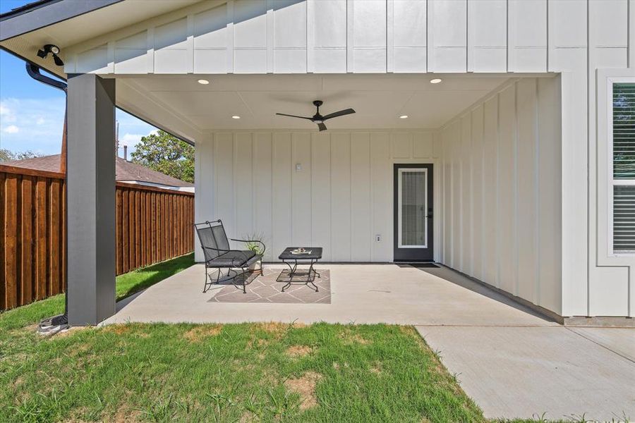 Back Covered Patio with an Outdoor Ceiling Fan.