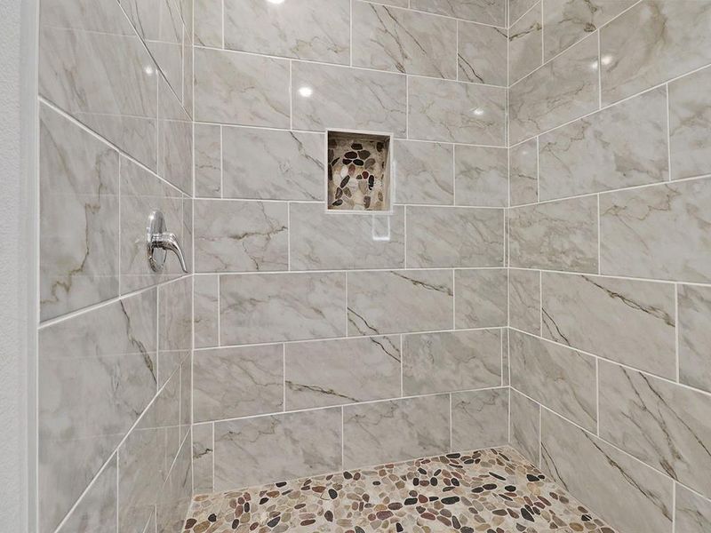 Bathroom with a tile shower