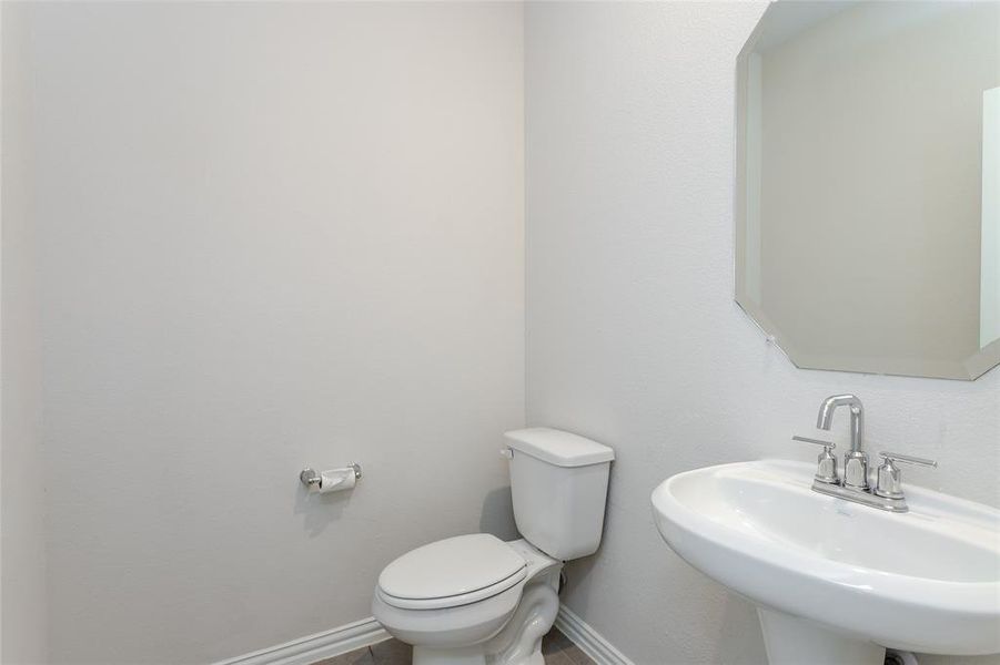 Bathroom featuring toilet and sink