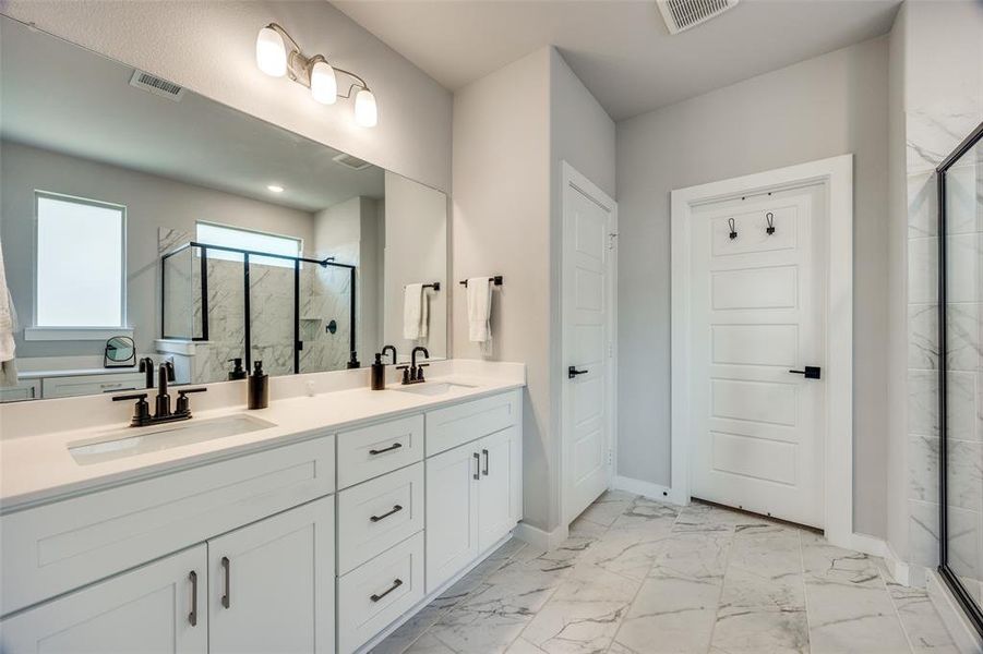 Primary Bathroom featuring vanity and a walk-in shower