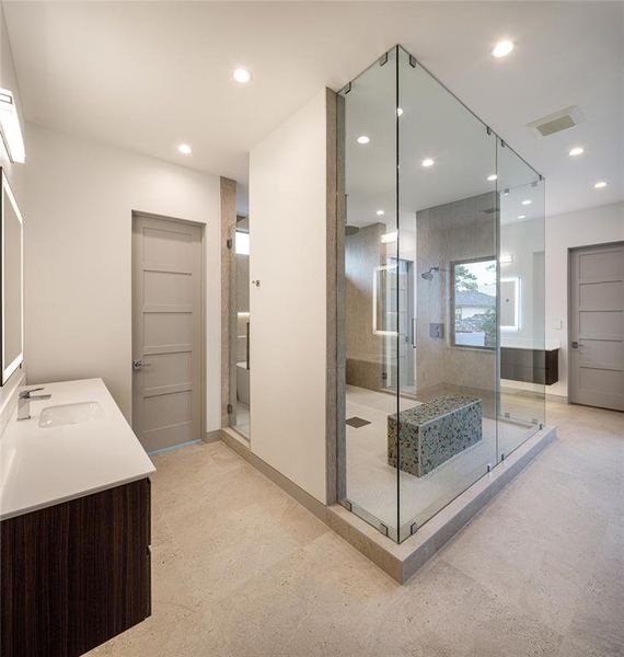 Primary bathroom features dual water closets and a private staircase as an alternate access