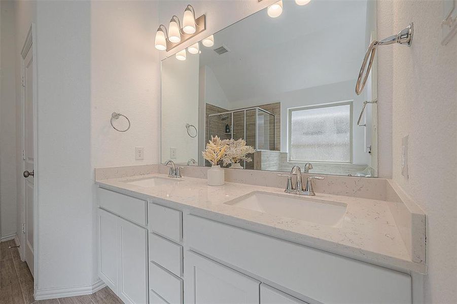 This bathroom is designed for convenience with its double sinks and ample counter space.