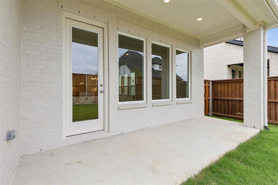 Dining al fresco is in your future on this lovely covered back patio.