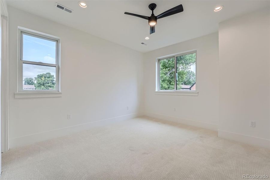 Third upper level bedroom with en-suite bath.