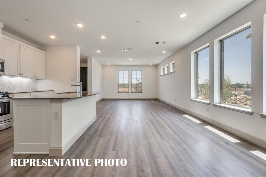 Windows everywhere in this fantastic end unit home!!  REPRESENTATIVE PHOTO.