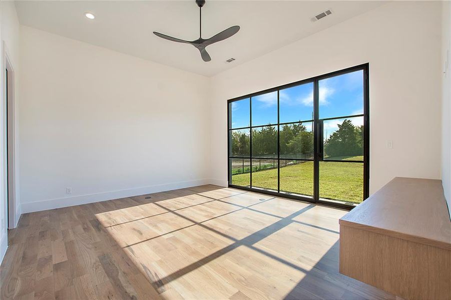 Spare room featuring light hardwood / wood-style flooring and ceiling fan